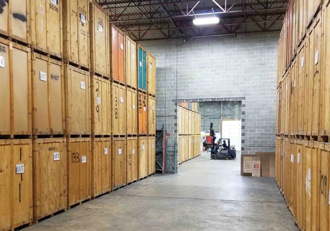 Interior of Sloan's climate-controlled storage facility in Manassas with stacked wooden vaults